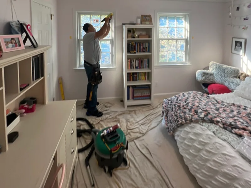 Caulking the interior of the Andersen window